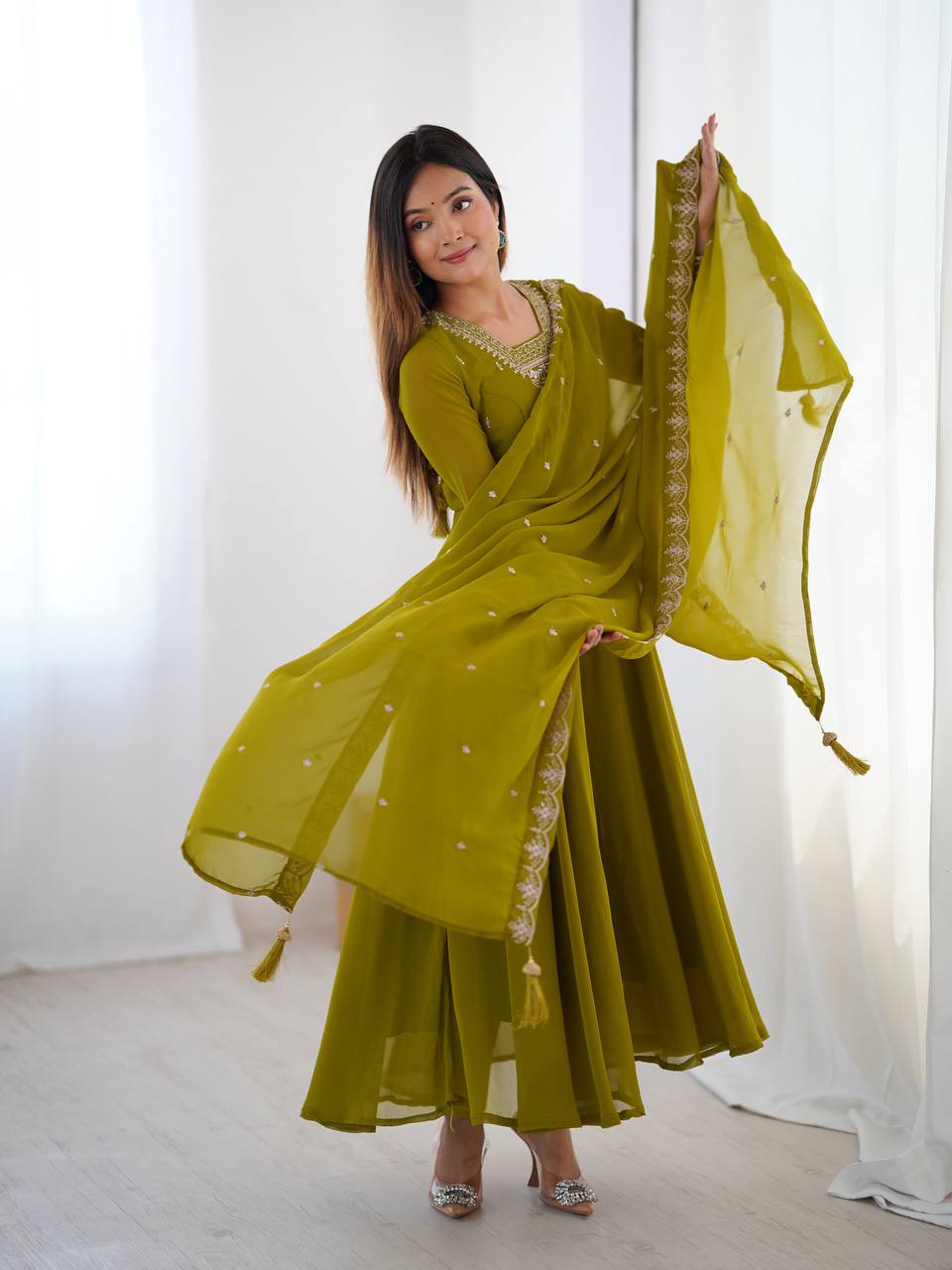 Green Anarkali suit in soft Fox Georgette with 6.5-meter flair, beads & zari embroidery, lace sleeves & dupatta – fully stitched & party-ready.